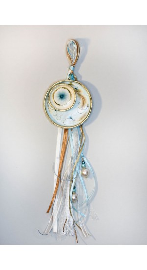 Ceramic charm hanging with ribbons and eye design